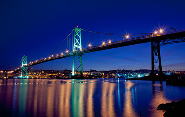 Angus L. Macdonald Bridge at twilight. The span connects Halifax and Dartmouth, Nova Scotia. - obrazy, fototapety, plakaty