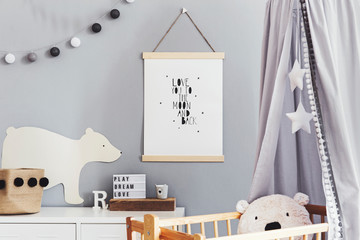 Stylish and cute scandinavian decor of  newborn baby room  with mock up poster , white design...