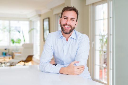 Handsome business man with a happy and cool smile on face. Lucky person.