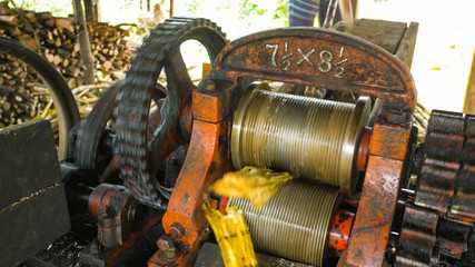 Machine used to crush raw sugar cane for its juice