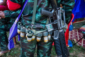 Mon soldier sling gun and bullet in Mon independence day