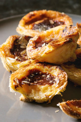 Traditional Portuguese egg tart dessert Pasteis Pastel de nata. Close up