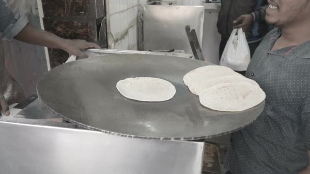 Cook prepares chapati