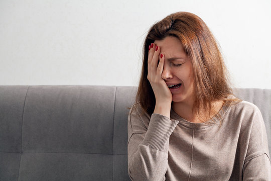  Female depression. Portrait of an upset young woman.