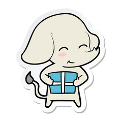 sticker of a cute cartoon elephant with gift