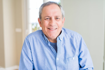 Handsome senior man smiling confident