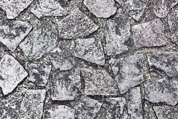Grunge and dirty pavement pattern. Gray uneven blocks floor background.