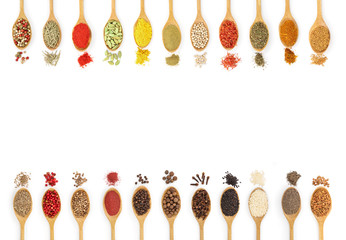 mix of spices in wooden spoon isolated on a white background with copy space for your text. Top...