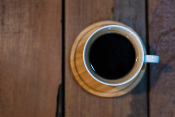 americano cup coffee on wooden table, Top view