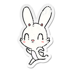 distressed sticker of a cute cartoon rabbit