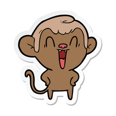 sticker of a cartoon laughing monkey