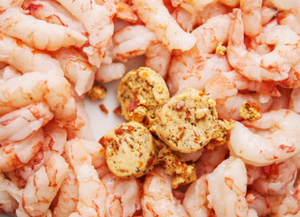 Herb and chill butter with prawns. Cooking sea food, close up, top view.