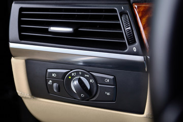Obraz na płótnie Canvas Control system headlights far and near light detect vehicles guard and air conditioning of car salon