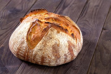 Rustic homemade bread on a wooden background