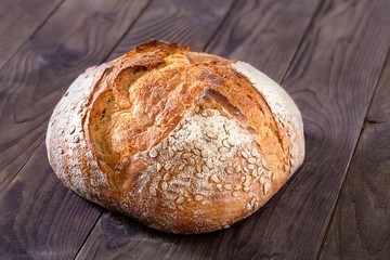 Rustic homemade bread on a wooden background