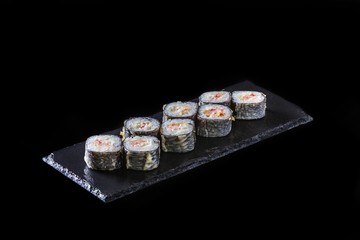 Japanese rolls on a black background