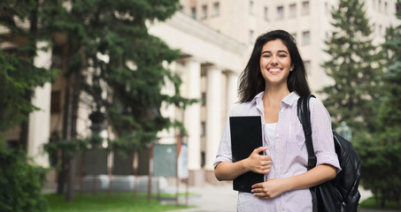 Happy beautiful student girl outdoor