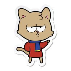 sticker of a bored cartoon cat in winter clothes