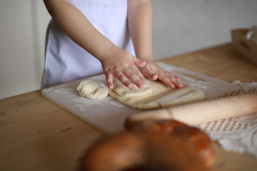hands making dough cakes, pizza in the kitchen
