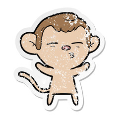 distressed sticker of a cartoon suspicious monkey