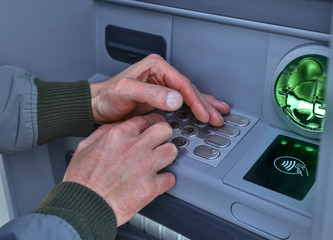 atm cash machine hands hiding pin