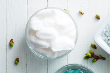 Beauty products and fresh leaf buds