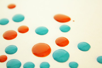 colorful paint drops close-up. macro photo on white background
