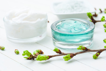 Beauty products and fresh leaf buds