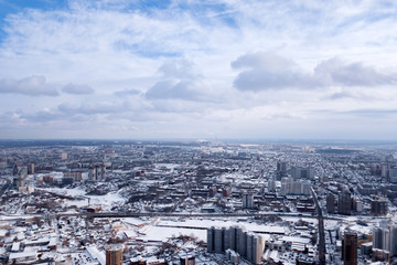 Winter landscape from a aerial view of the city of Novosibirsk in the haze with streets, small...