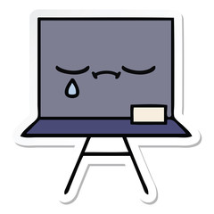 sticker of a cute cartoon chalkboard