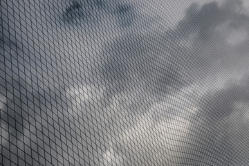 Net structure with dar, cloudy background