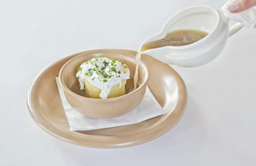 Pouring soup into a bowl