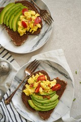 Avocado egg toast with brown bread / Healthy breakfast concept