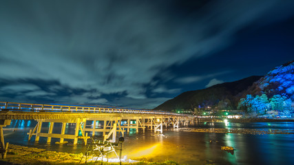 Long exposure of the Togetsukyo Bridge, which is seen being illuminated in Kyoto's Arashiyama during the special Hanatoro event, where famous areas are being illuminated by lanterns.