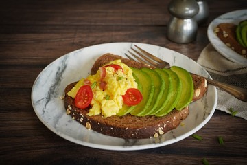 Avocado egg toast with brown bread / Healthy breakfast concept