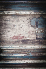 background from an old rusty metal sheet with faded rough frayed shabby paint