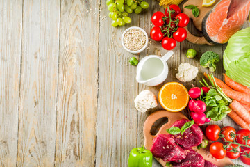 Flexitarian diet diet, with fresh vegetables, raw meat and fish, legumes, grains, fruit, wooden background, copy space top view
