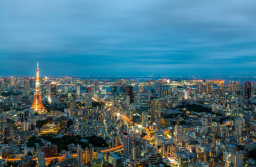City skyline and cityscape of Tokyo City seen from the observatory deck of Roppongi Hills during sunset.
