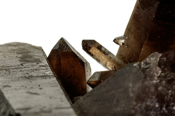 Macro mineral stone smoky quartz, rauchtopaz on a white background