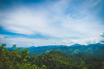 Obraz premium Blue sky high peak mountains fog hills mist scenery river lake dam bay gulf wildlife National park views Kanchanaburi, Thailand.