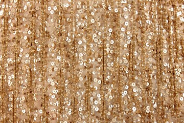 Fabric with sequins and sequins of bright colors. Fashion glitter fabric, sequins. Shiny surface