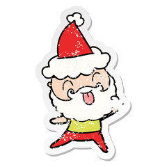 man with beard sticking out tongue wearing santa hat