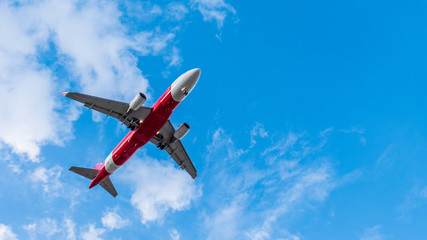 Airplane flying on blue sky. Free space for text