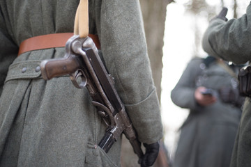 Automatic machine gun on the belt of an SS officer.