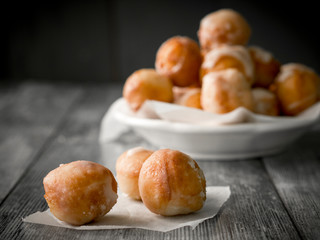 Small homemade doughnuts, also known as doughnut holes, prepared for Polish Fat Thursday. On the...