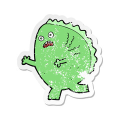 retro distressed sticker of a cartoon monster