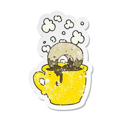 retro distressed sticker of a cartoon donut dunked in coffee