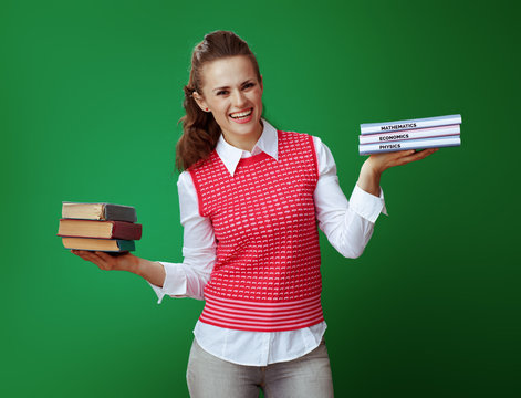 Happy Healthy Learner Woman Weighs Old And New Textbooks