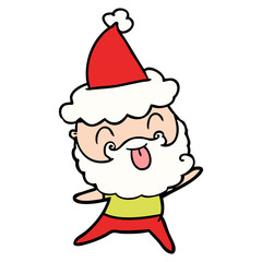 man with beard sticking out tongue wearing santa hat