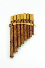 Pan flute instrument on white background. © irwanbujang